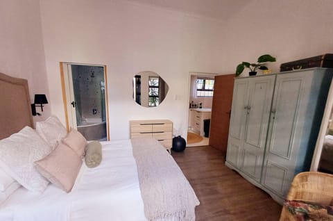 Bedroom with a queen size bed and en suite bathroom