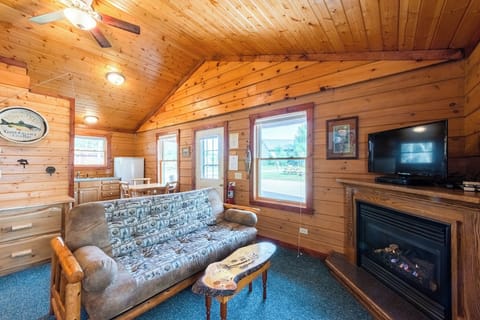 Cedar Cabin Living Space

Enjoy the amenities of home in the quaint 2 bedroom log cabin.  This is a view into the kitchen, big enough to cook & enjoy meals or small enough if you would rather leave the mess to someone else and eat out!    The log cabins on the Ranch all have gas fire places.  They are nice to enjoy watching the fire, but they are also an alternative heat source for the cabin!  