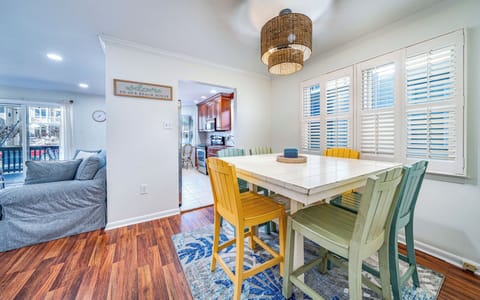 Colorful dining area with seating for six and open layout