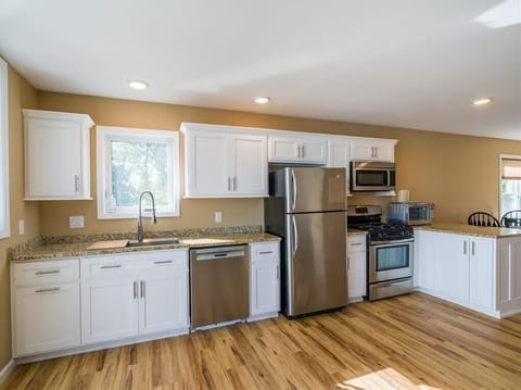 Fully equipped Custom Built Kitchen with stainless appliances. 