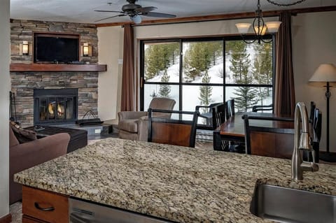 Enjoy warm evenings by the fire with scenic outdoor views.