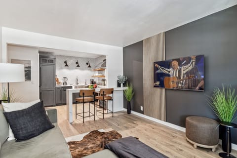 Warm and cozy living room featuring a Smart TV for entertainment and designer furnishings.