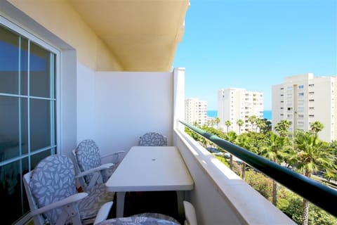 Terrace facing south with sea views and dining area for four guests