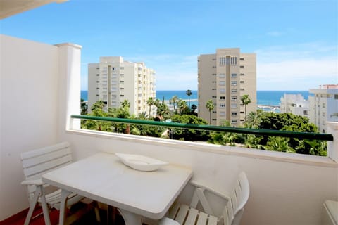 Private terrace with outdoor dining area for four guests and beautiful sea views