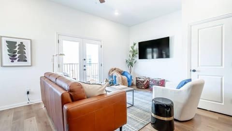 Step outside to the balcony for some fresh air and city views.