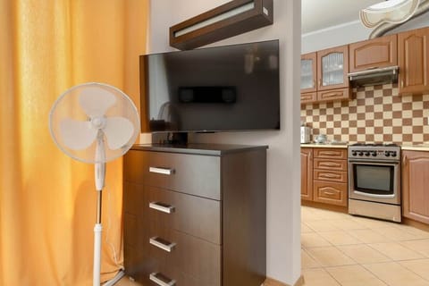 The kitchen's contemporary decor complements the studio's style.