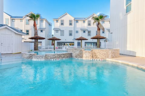 Take a dip and unwind at the community pools at Mango Cay.