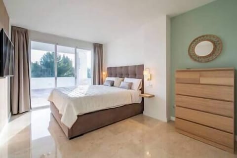 Two bedrooms with double bed, storage space and access to the terrace. (1)