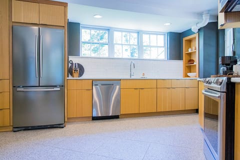 Large windows and new stainless steal appliances make this a dream kitchen