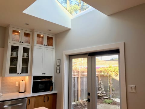 Large Kitchen Skylight and Patio Doors  