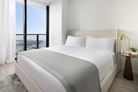Drift off beside floor-to-ceiling windows and ocean breezes.