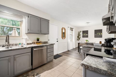 Fully Furnished Kitchen Open to Dining Area