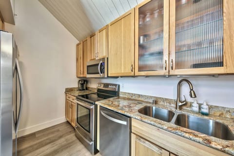 Modern kitchen with stainless steel appliances and beautiful stone counter tops