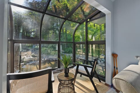 Sitting area overlooks the pond and surrounding garden