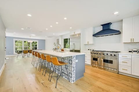 State of the art full size kitchen with Viking gas range stove and two ovens. 