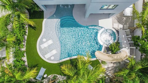 Daytime - Aerial - Resort Style Pool w/ Water Slide and Heated Spa