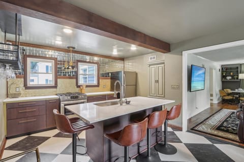 Brighter view of the open concept living/kitchen/dining area.