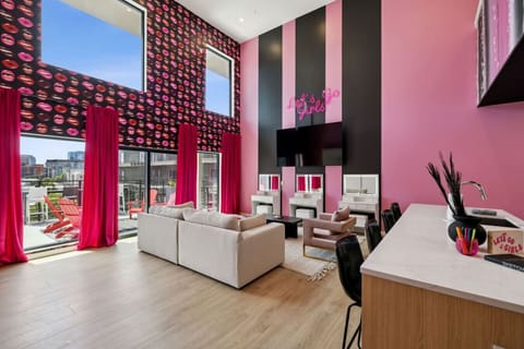 Spacious open-concept loft with bold glam vibes, Smart TV, full kitchen + bar seating, and 3 makeup vanities with LED lighting—perfect for getting ready and starting the night in true Nashville style!
