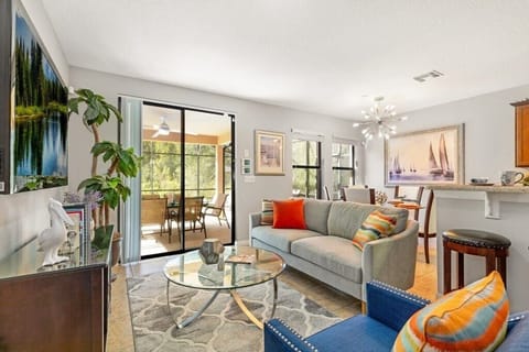 Back open floor plan bonus 2nd living room, dining and kitchen areas all with lovely views of the private patio & pool.