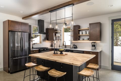 Chef's Kitchen Amenities – A dream setup with gas range, oversized fridge, and all the essentials to cook like a pro.