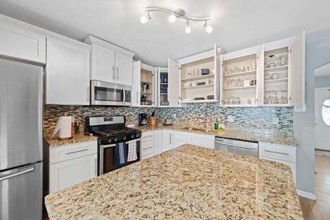 Transforming ordinary ingredients into extraordinary meals in this stunning kitchen! The granite counter top and stainless steel appliances add a touch of elegance to our culinary adventures. 🍽️✨ #KitchenInspiration #GourmetCooking #DreamKitchen