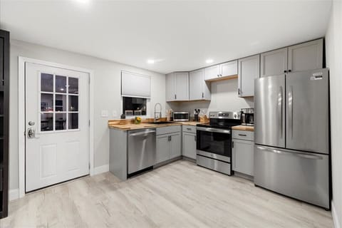 Kitchen equipped with a full range of appliances, including a stove, refrigerator, microwave, and dishwasher.