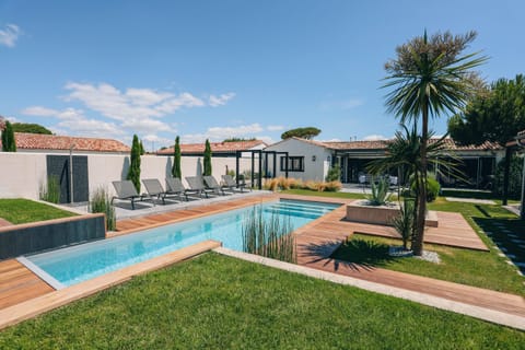View of the villa, pool and garden