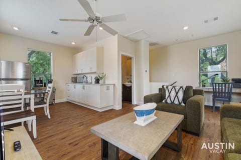 Living area upstairs with sleeper, smart tv, kitchenette, work desk, and balcony!!