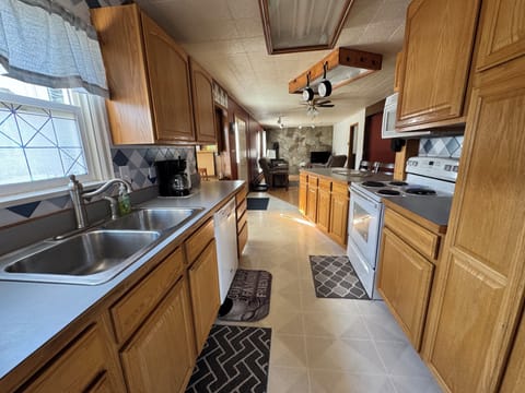 View from the east entrance into the kitchen looking at the living room.