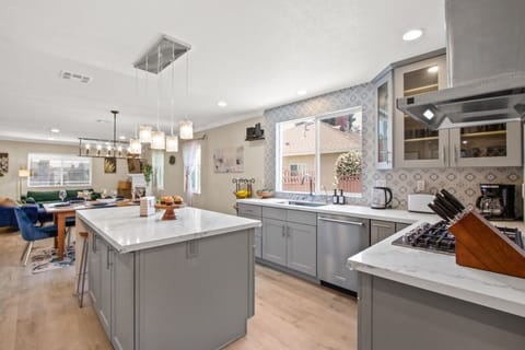 Enjoy a chef’s dream kitchen with a wine fridge, air fryer, and all the necessary cooking tools.