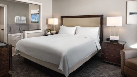 Master bedroom with full size whirlpool tub in bathroom