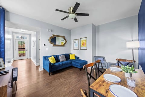 Living Room: Chic, comfortable, and filled with natural light — the perfect space to unwind or catch up on your favorite shows