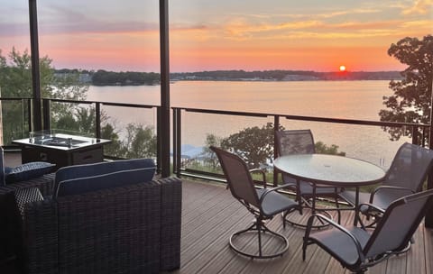 Enjoy the lake views and sunsets from the expansive, wrap-around, covered deck