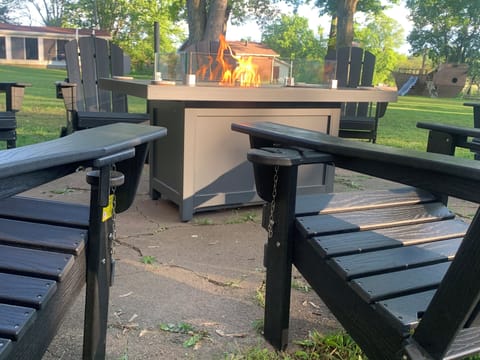 Just slide the wine or cup holders out on these Adirondack chairs and relax