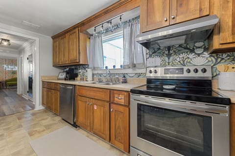 The kitchen has plenty of space for cooking meals