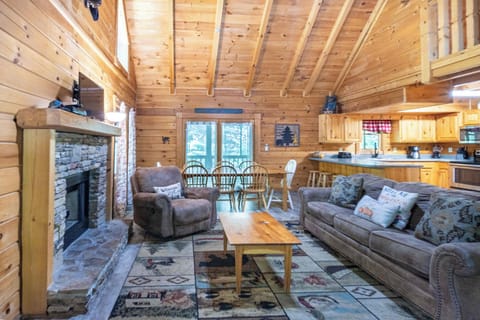 Living Room: Experience mountain views and warmth by the fireplace in this inviting cabin retreat!