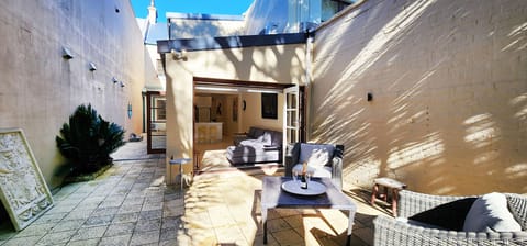 North facing private paved back courtyard.  Can fit 2 cars tandem.