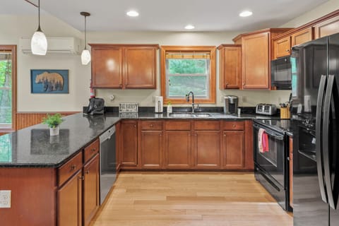 Experience the convenience of our spacious, fully stocked kitchen.