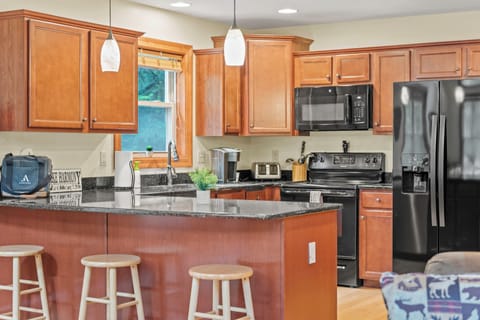 Enjoy casual dining at our kitchen counter with convenient stools.