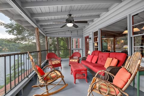 Lots of seating on the upper level screened in porch for enjoying the lake views.