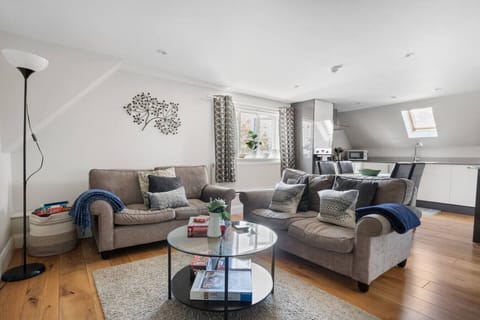 Open-plan lounge with Smart TV and comfortable seating