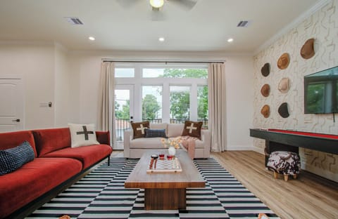 Modern wester interior for the living room with 2 couches and shuffleboard & TV