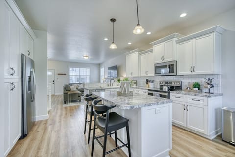 Bright and open kitchen featuring sleek appliances and ample counter space.