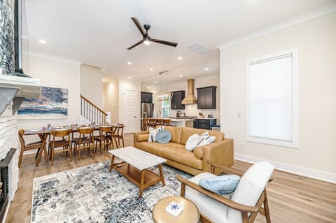 Main living room with kitchen in background