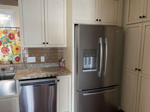 Full sized refrigerator with icemaker.