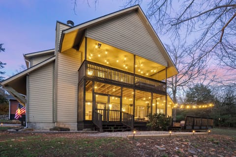 Enjoy your backyard wooded oasis on one of three well-lit porch areas!