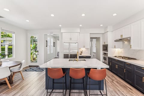 The kitchen island seats three