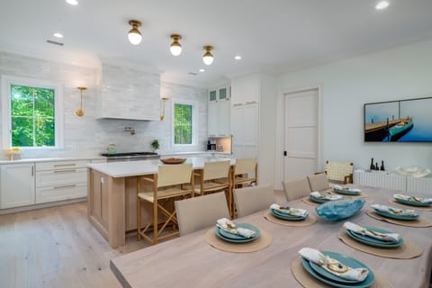 The dining area opens to the gourmet kitchen