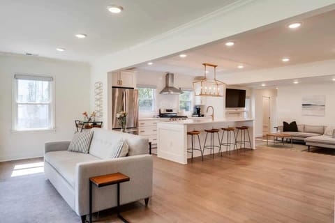 Living Room: A beautifully bright and expansive living room designed for comfort, light, and effortless relaxation.