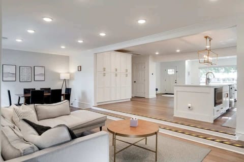 Living Room: A beautifully bright and expansive living room designed for comfort, light, and effortless relaxation.